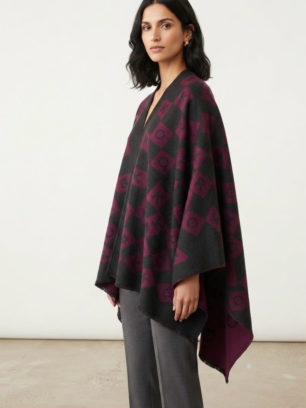 MICHAEL KORS Women’s black and Plum Patterned Poncho Sweater.